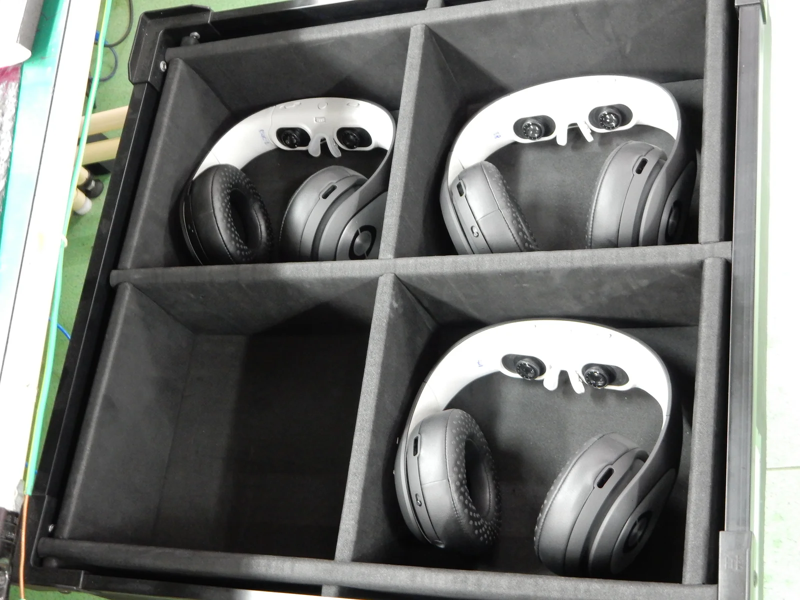 Assembled Glyph units held in separate compartments of a padded handling tray.