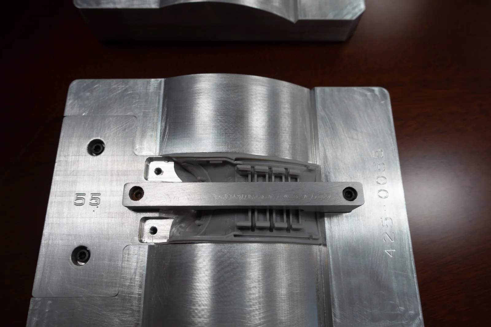 An inner liner supported in its shaped inspection nest.