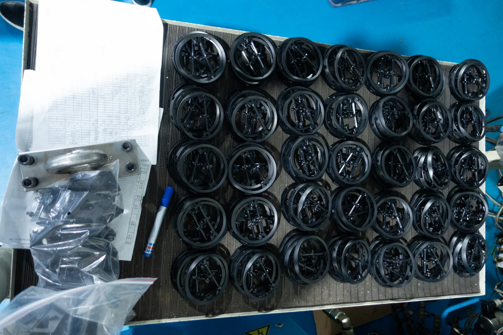 Trial parts arranged at one of my press-side QC stations.