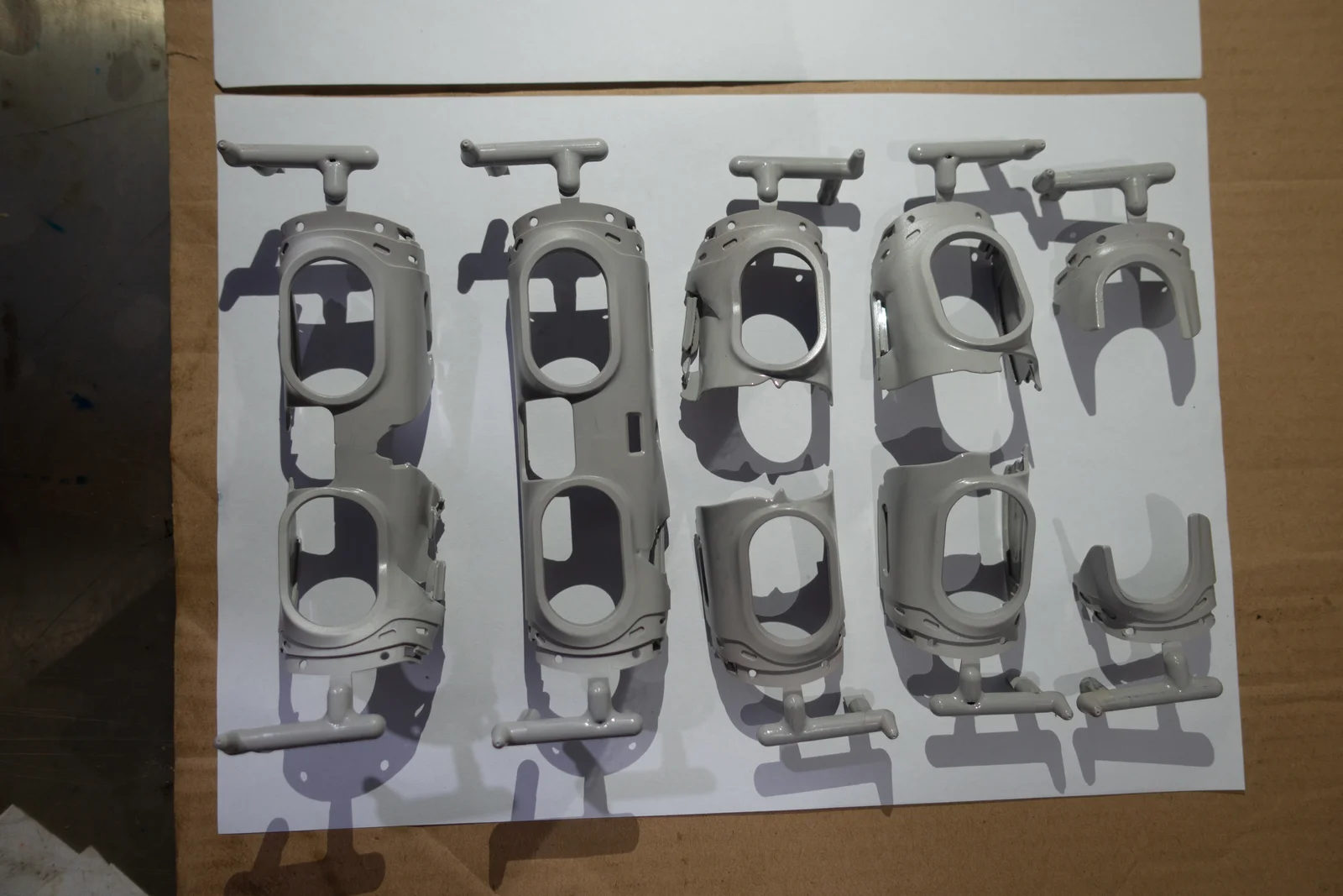 Faceplate trial parts, with molded runners still attached.
