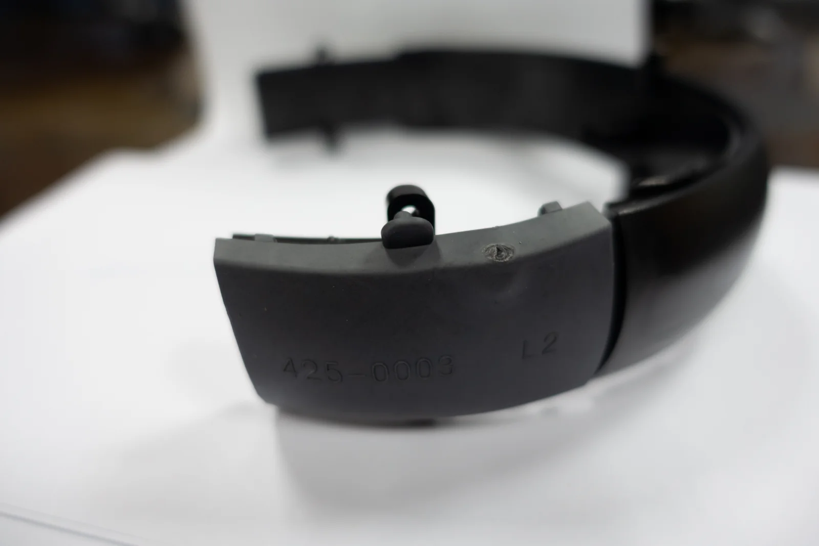 Another fitted masking interface on a curved production part.
