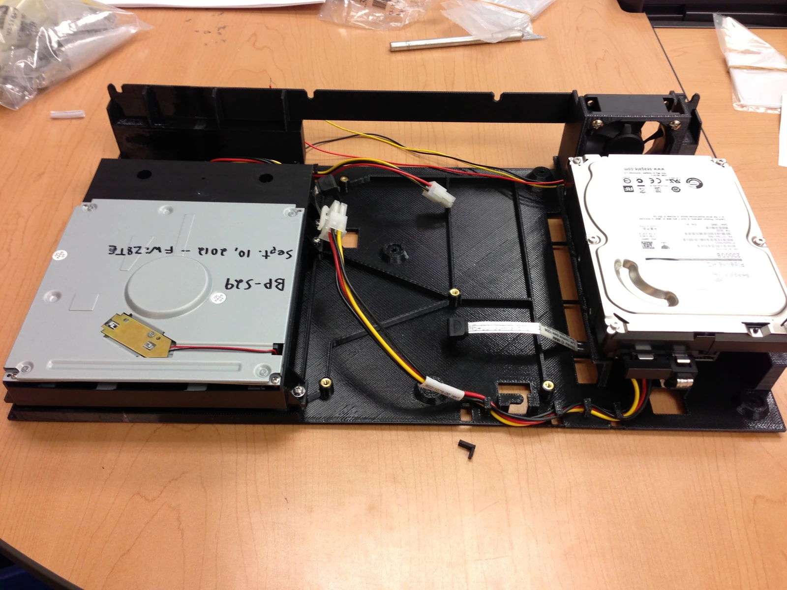 Printed subchassis with optical drive, hard drive and fan