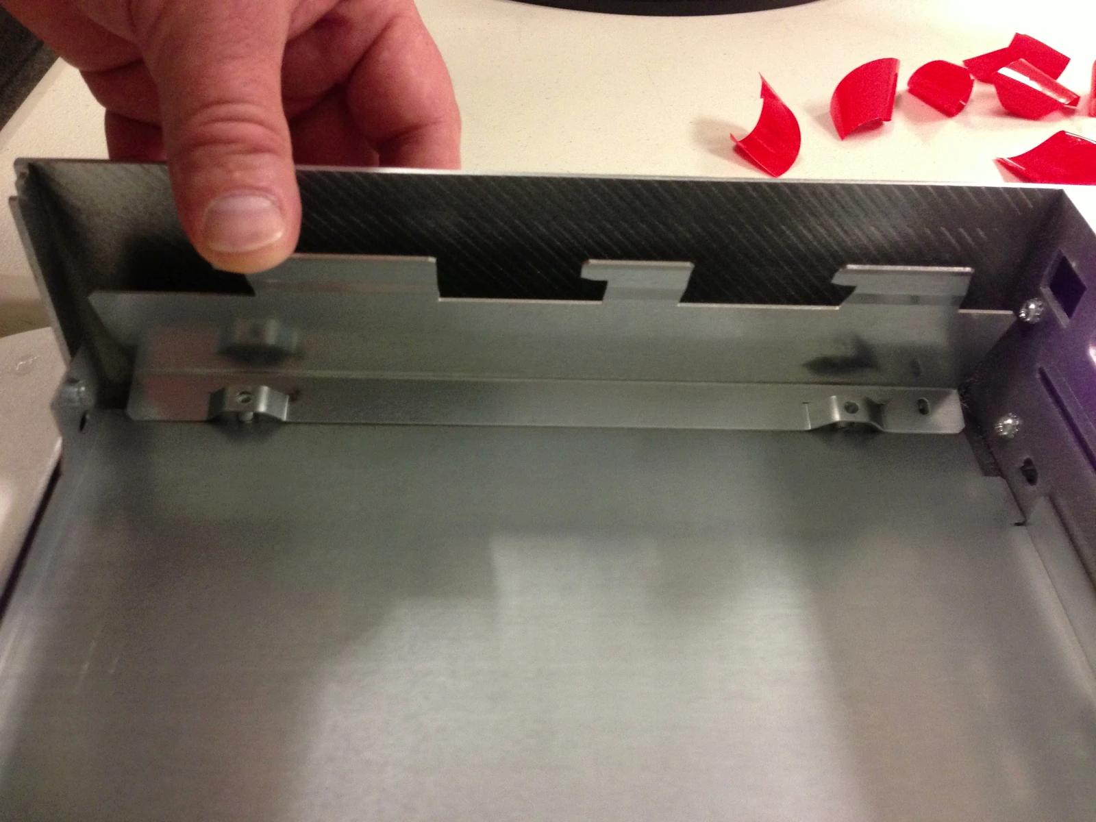 Side stiffener positioned inside the cover